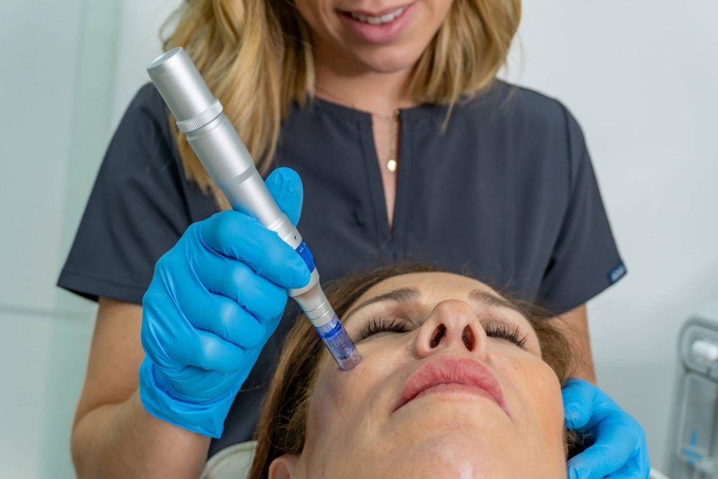 An aesthetic nurse performing her duties on a client