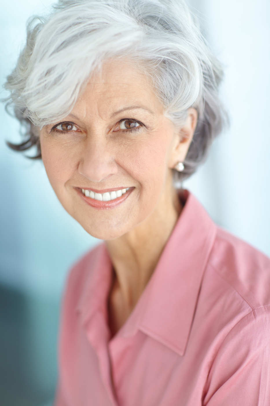 A happy older woman with a warm, confident smile